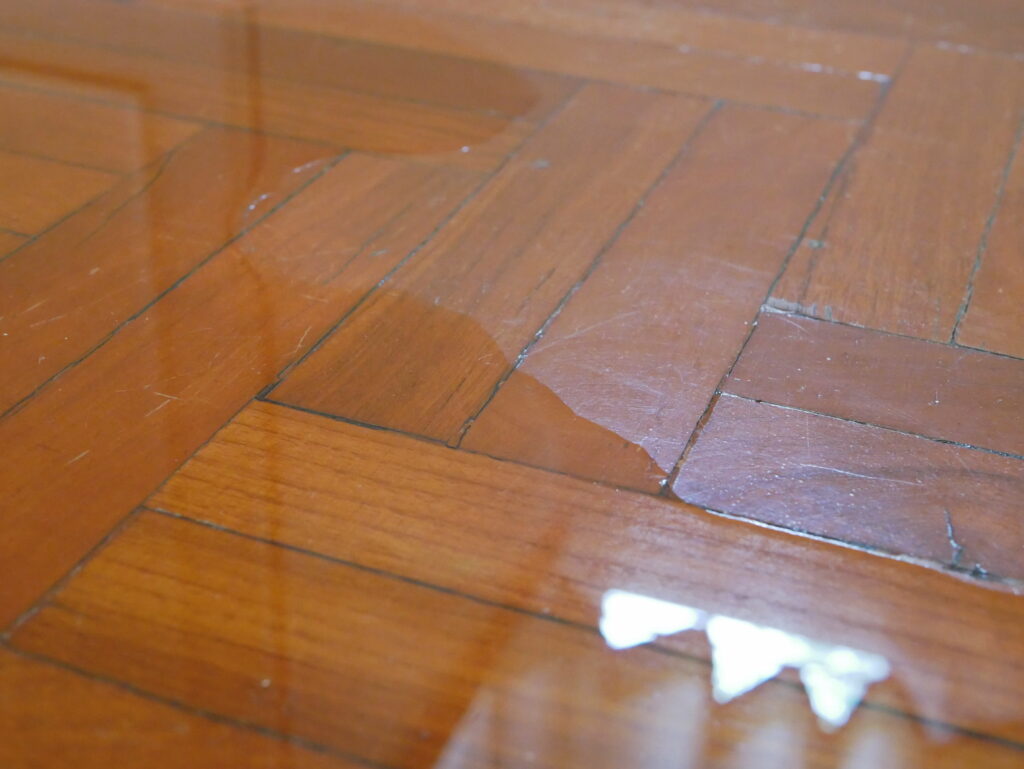 why is water seeping through basement floor